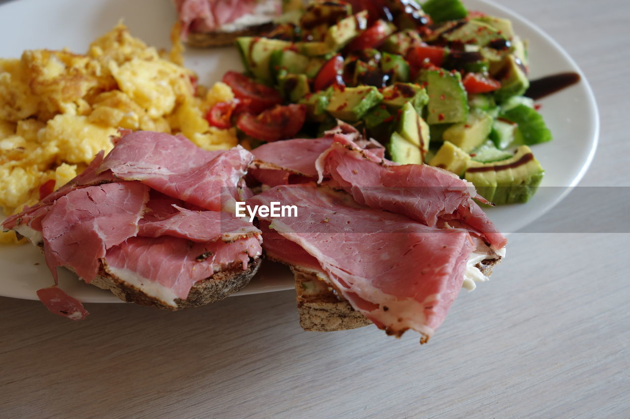 Close-up of meat with vegetables in plate on table