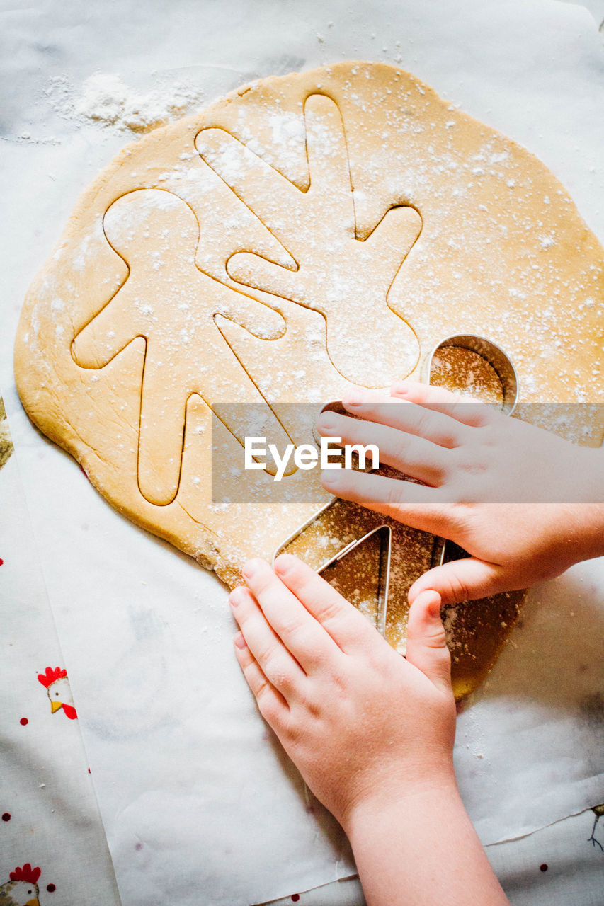 Child making gingerbread men