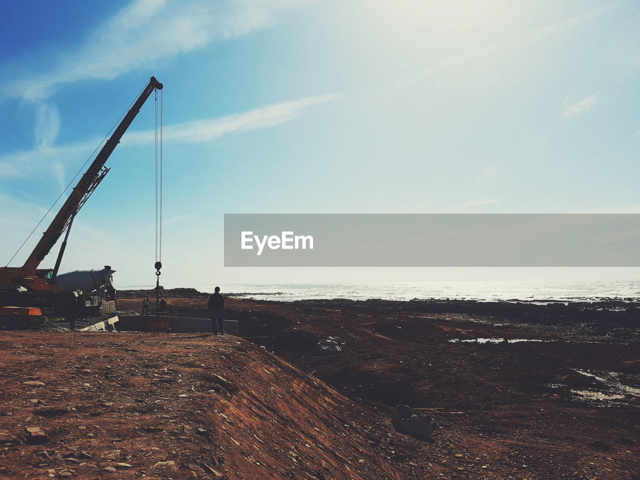 Scenic view of construction site against sky