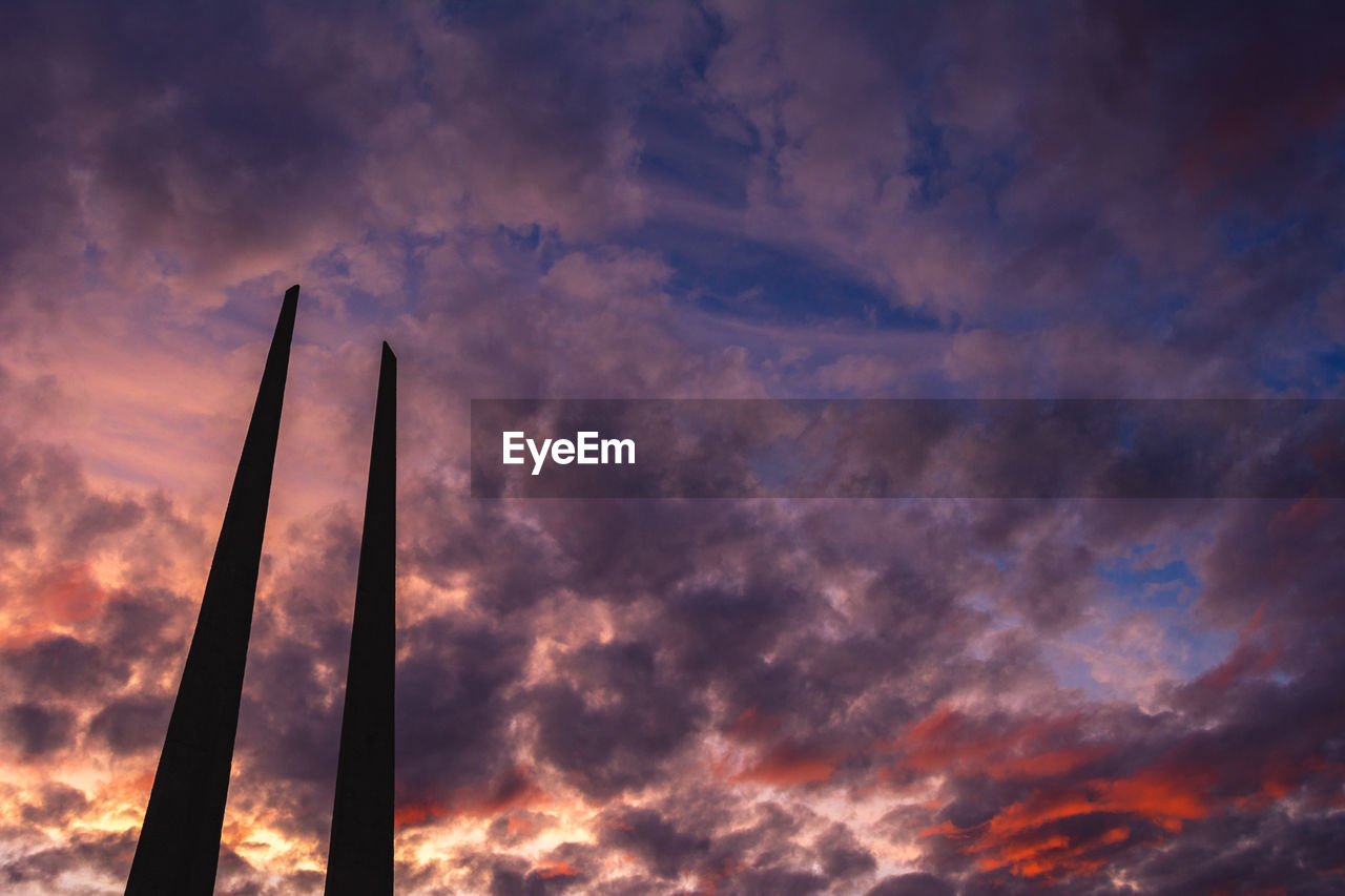 sky, cloud, sunset, afterglow, evening, dusk, dramatic sky, nature, sunlight, horizon, beauty in nature, no people, environment, architecture, scenics - nature, red sky at morning, cloudscape, outdoors, low angle view, orange color, moody sky, built structure, tranquility, industry, silhouette