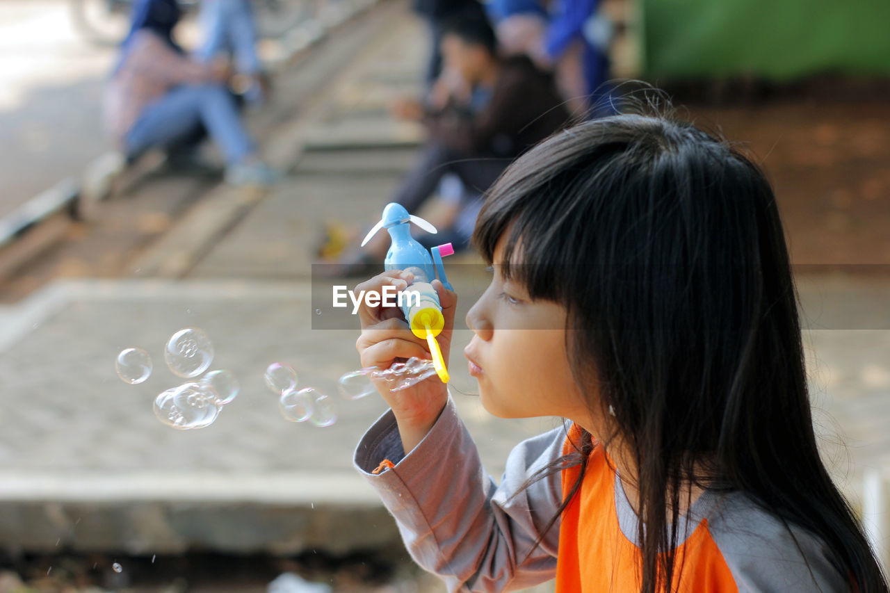 Portrait of girl with bubbles