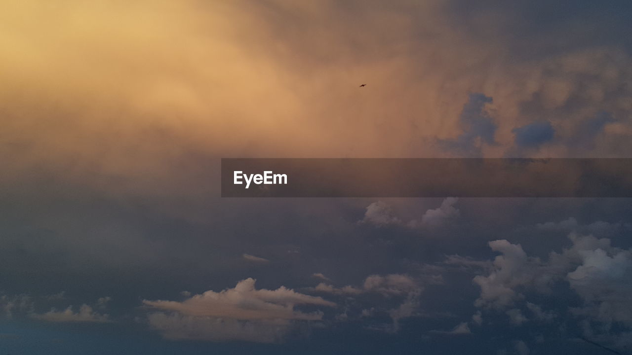 LOW ANGLE VIEW OF CLOUDSCAPE AGAINST SKY DURING SUNSET