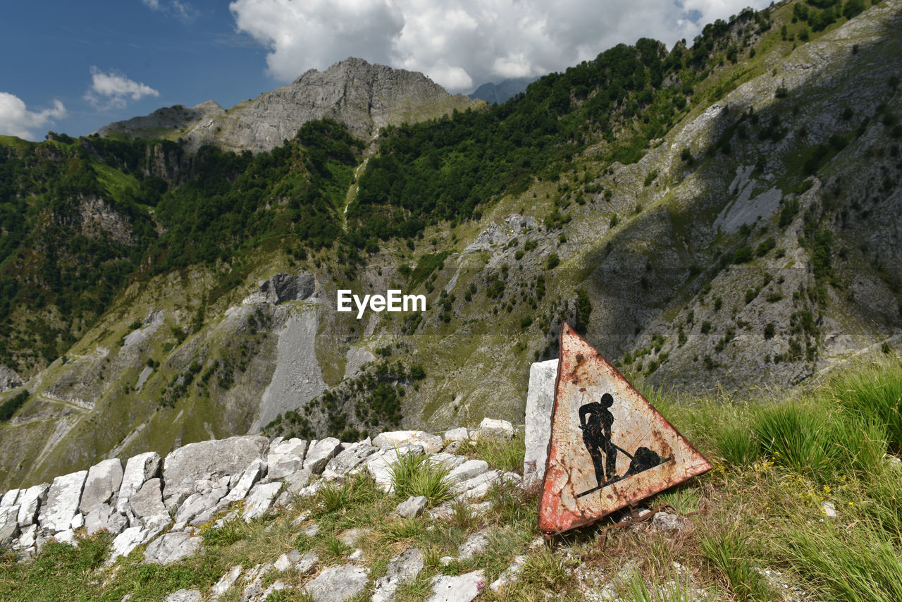Damaged road sign on mountain