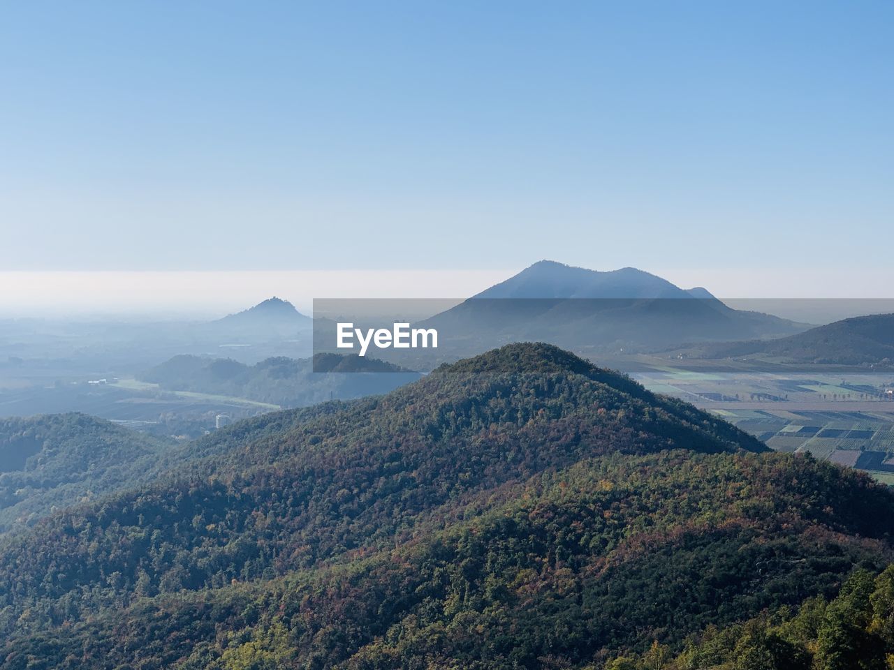 Scenic view of mountains and hills against clear sky