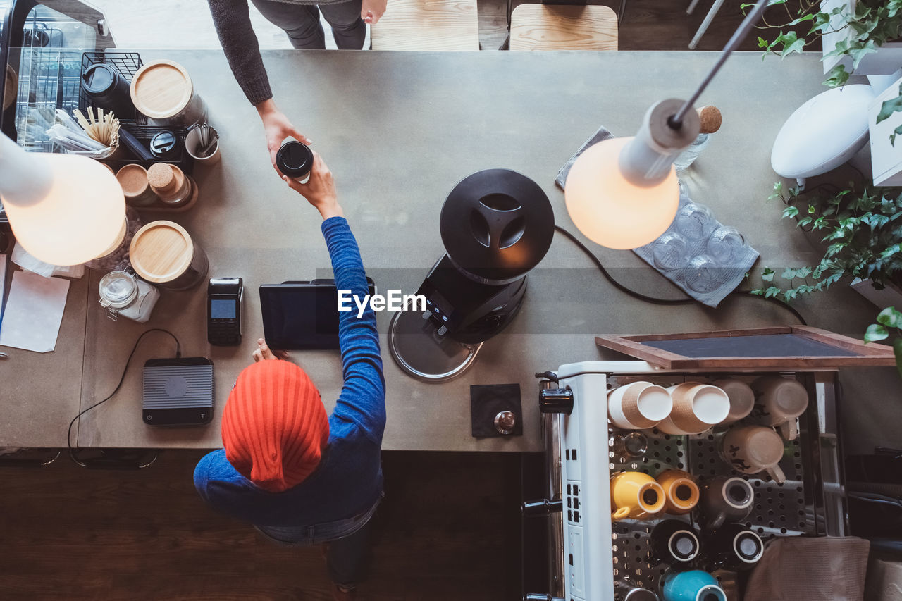 high angle view of people working in workshop