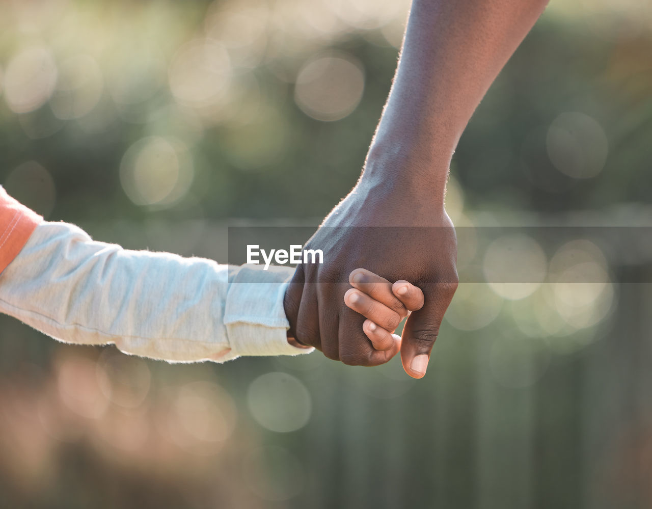 cropped hand of woman holding hands