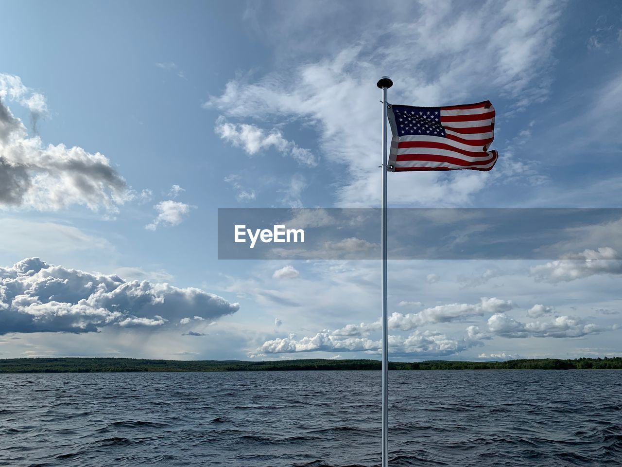 SCENIC VIEW OF FLAG AGAINST SKY