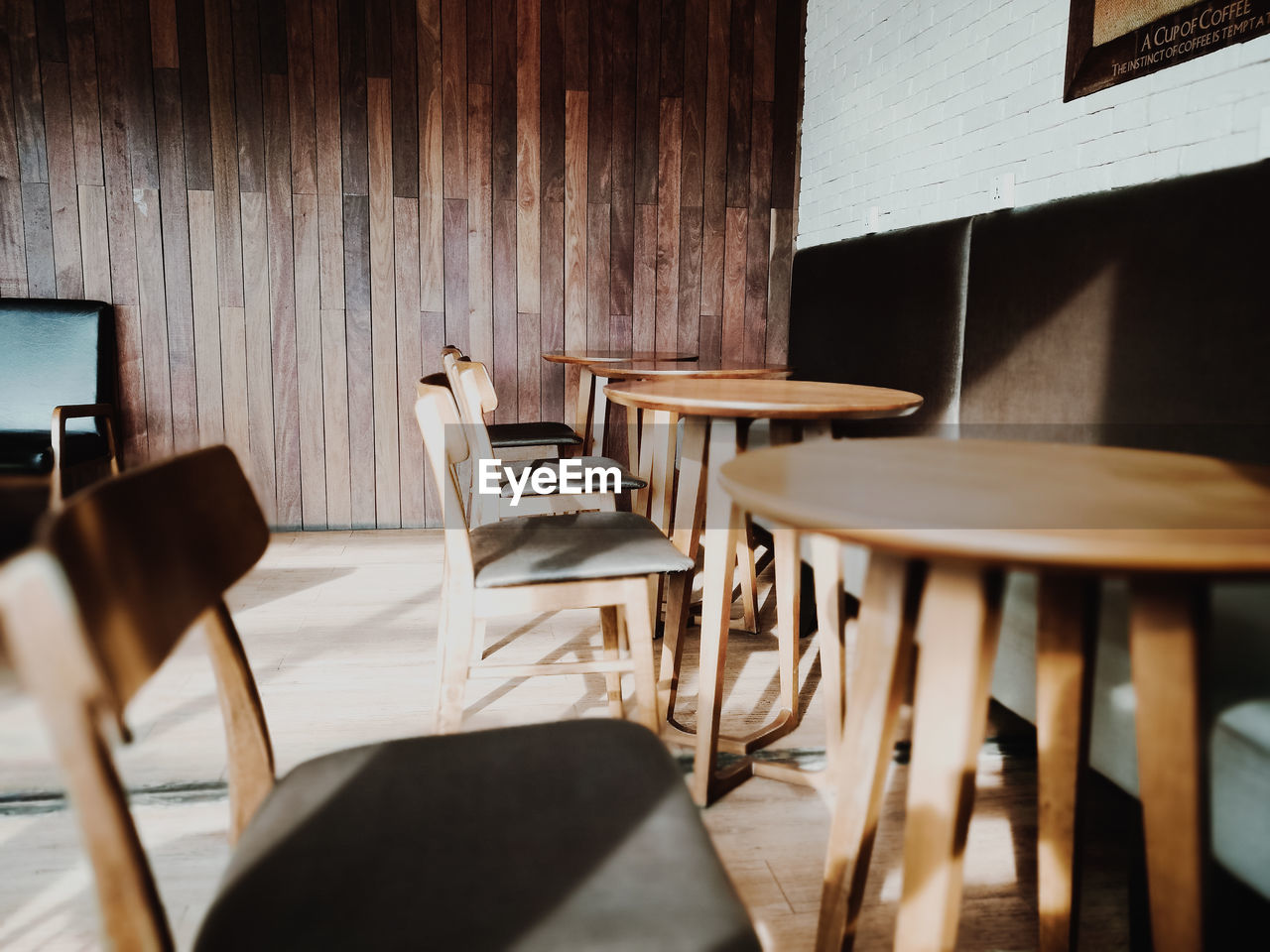 Empty chairs and tables at cafe