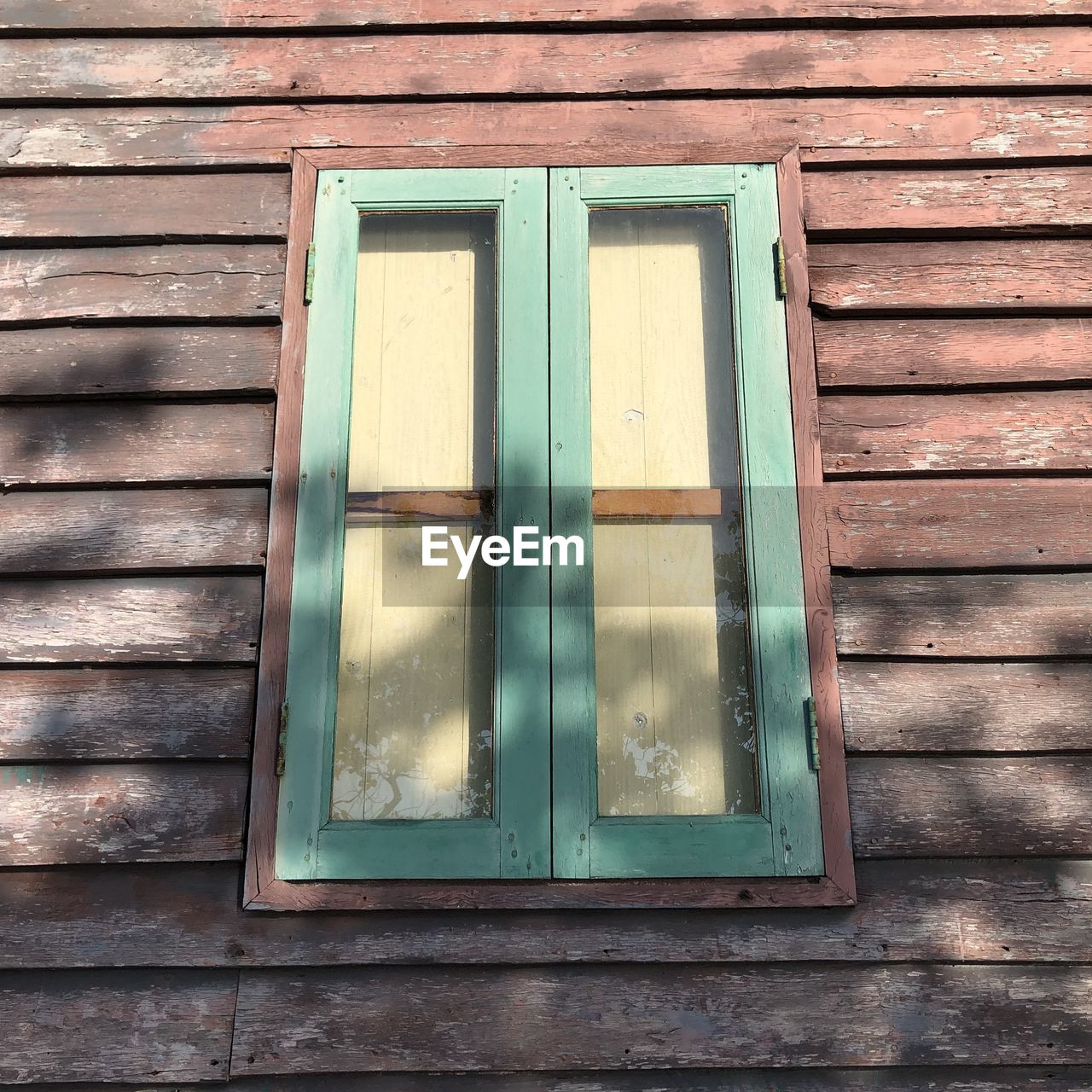 Closed window of wooden house