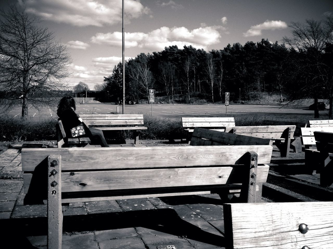 Young woman looking at football field in park