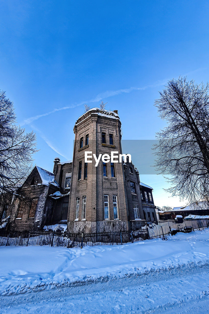 winter, architecture, snow, built structure, building exterior, sky, cold temperature, nature, tree, building, blue, history, the past, no people, plant, travel destinations, place of worship, house, day, bare tree, outdoors, religion, city, landscape, frozen, clear sky, low angle view, travel