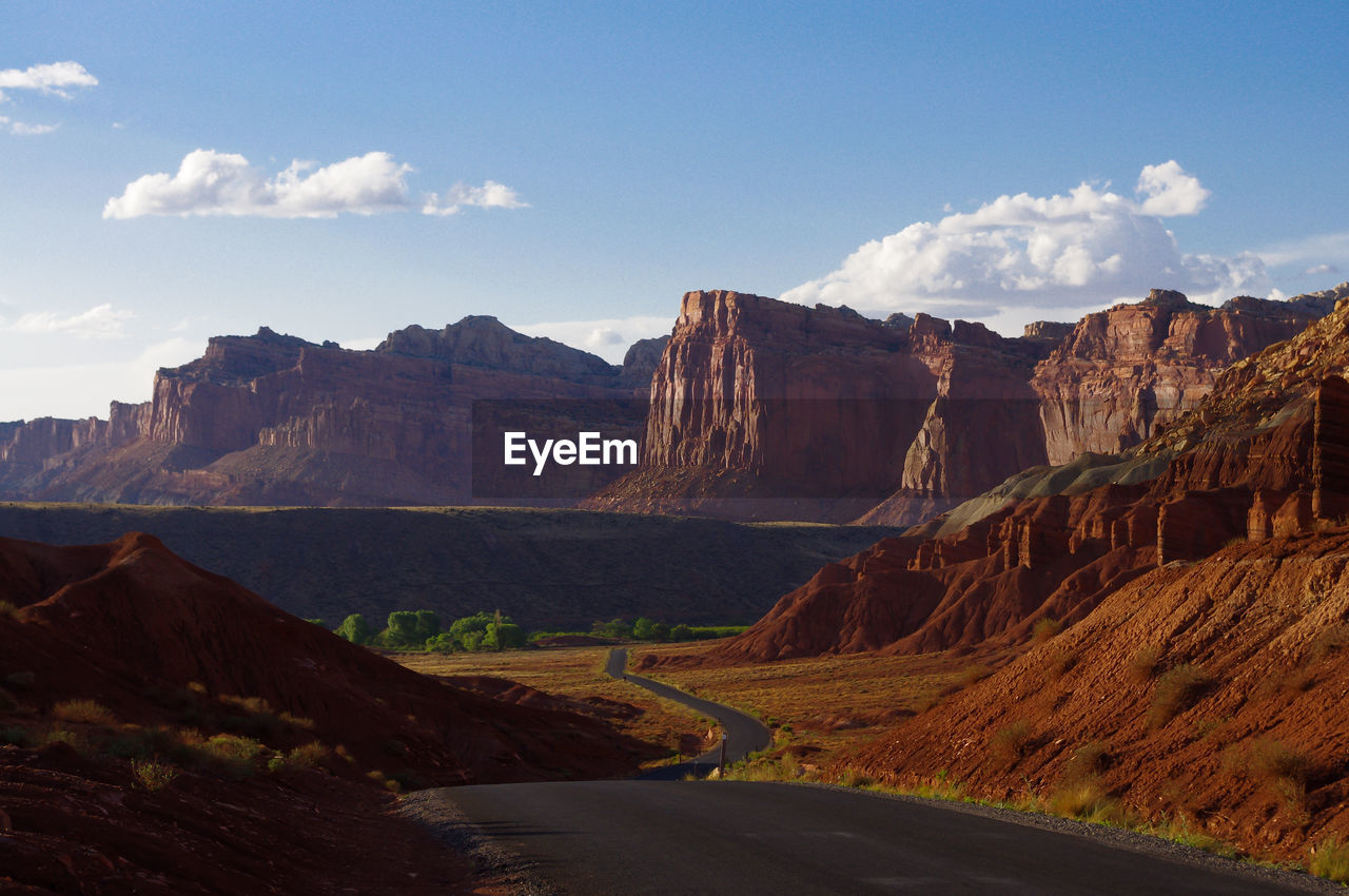 Scenic view of mountain road against sky