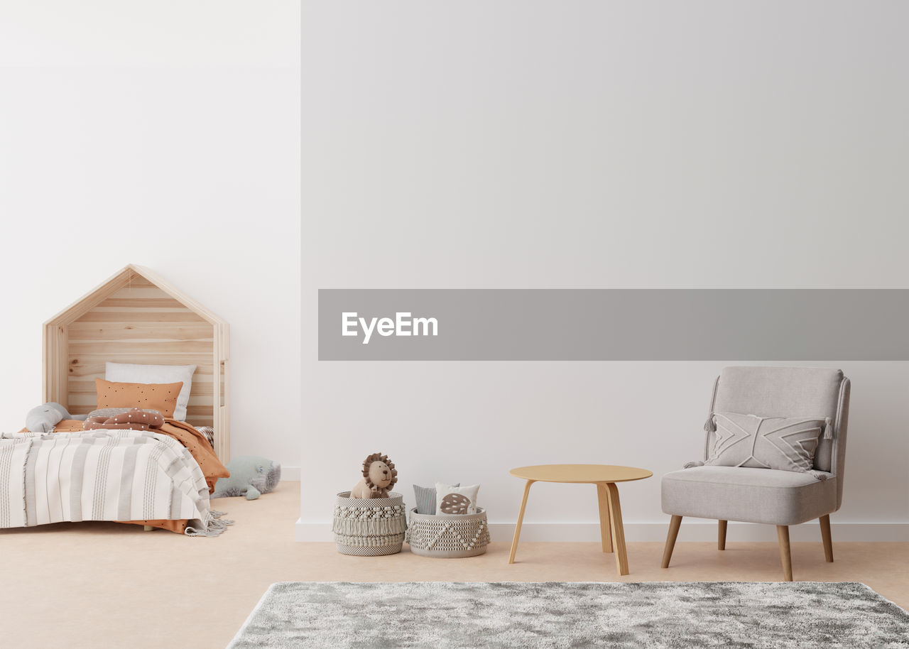 Empty white wall in modern child room. mock up interior in scandinavian, boho style. copy space  