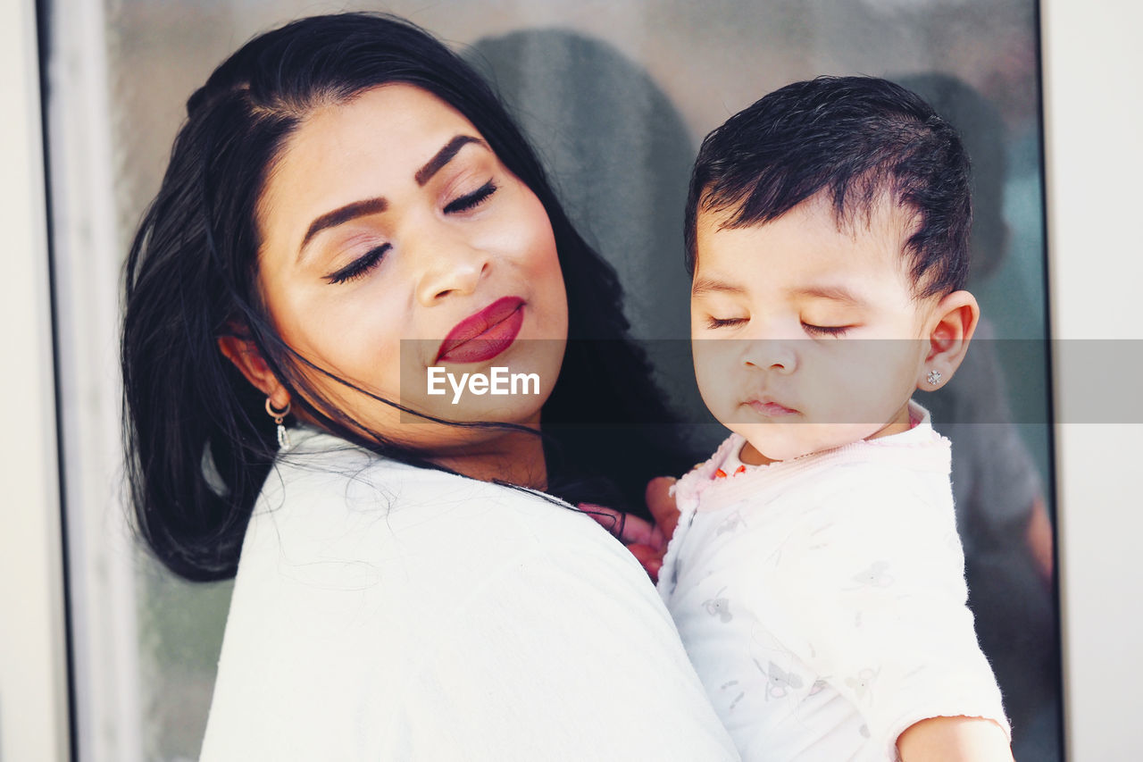 Portrait of mother and daughter