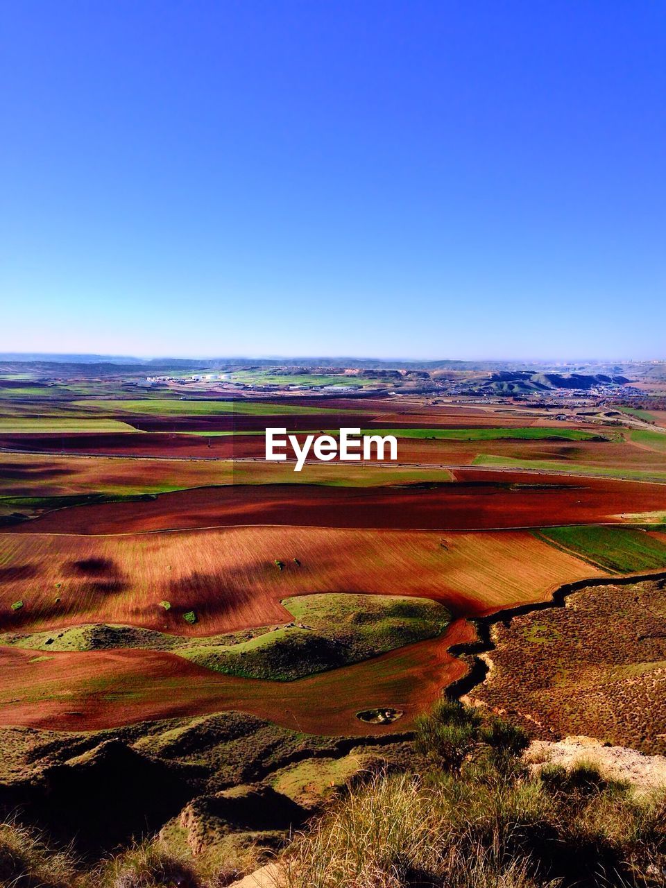 Scenic view of landscape against clear blue sky