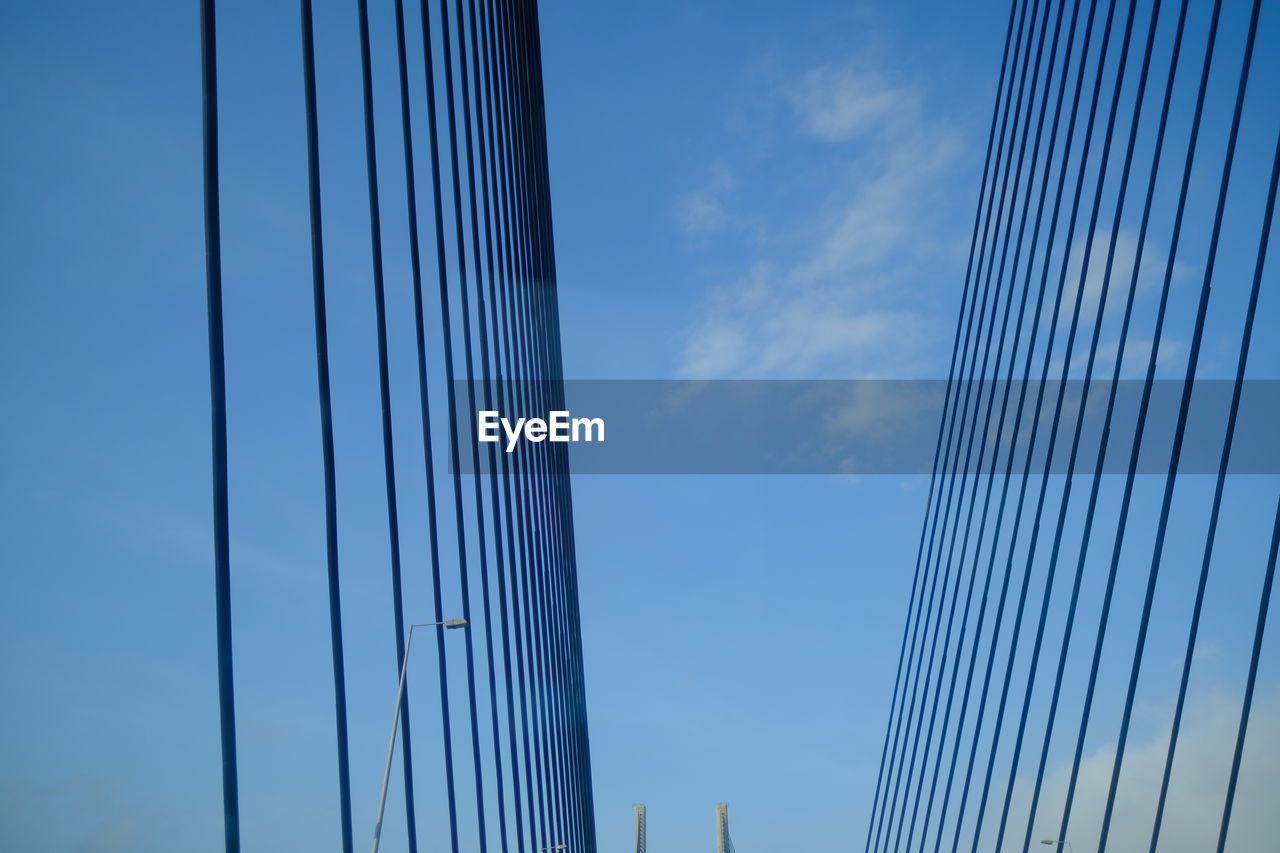 LOW ANGLE VIEW OF SUSPENSION BRIDGE