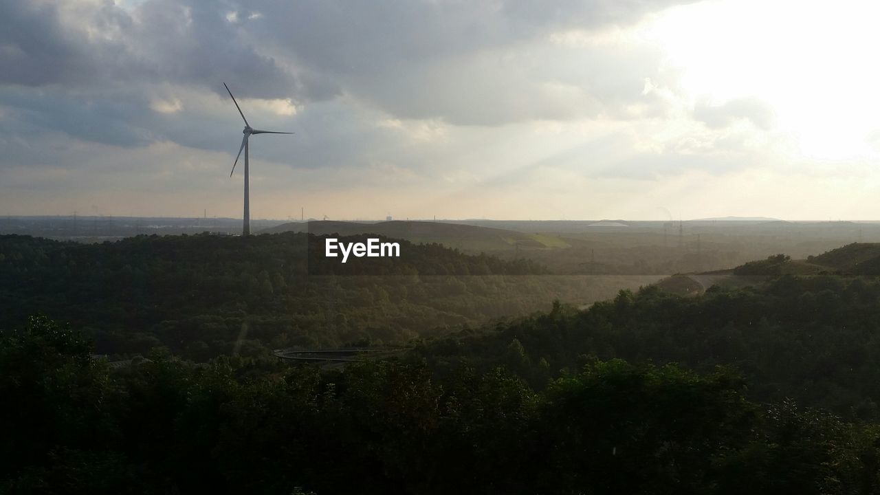 Scenic view of landscape against cloudy sky