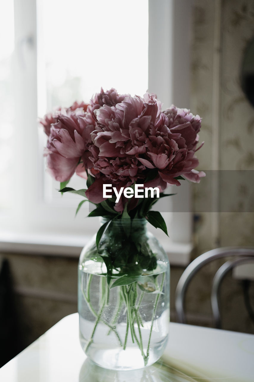 Close-up of flower vase on table