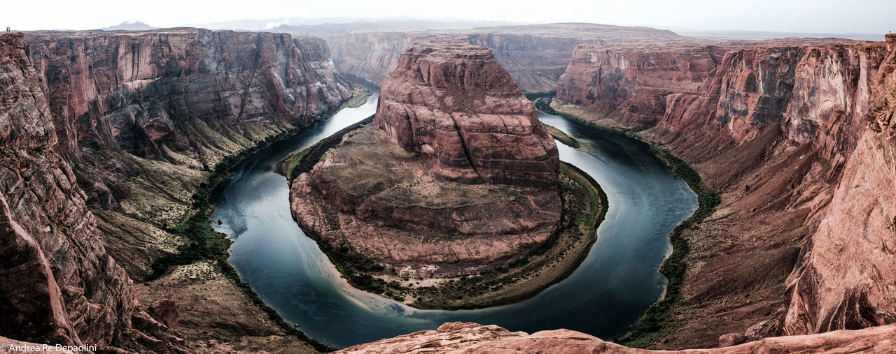 Panoramic view of colorado river through horseshoe bend canyon