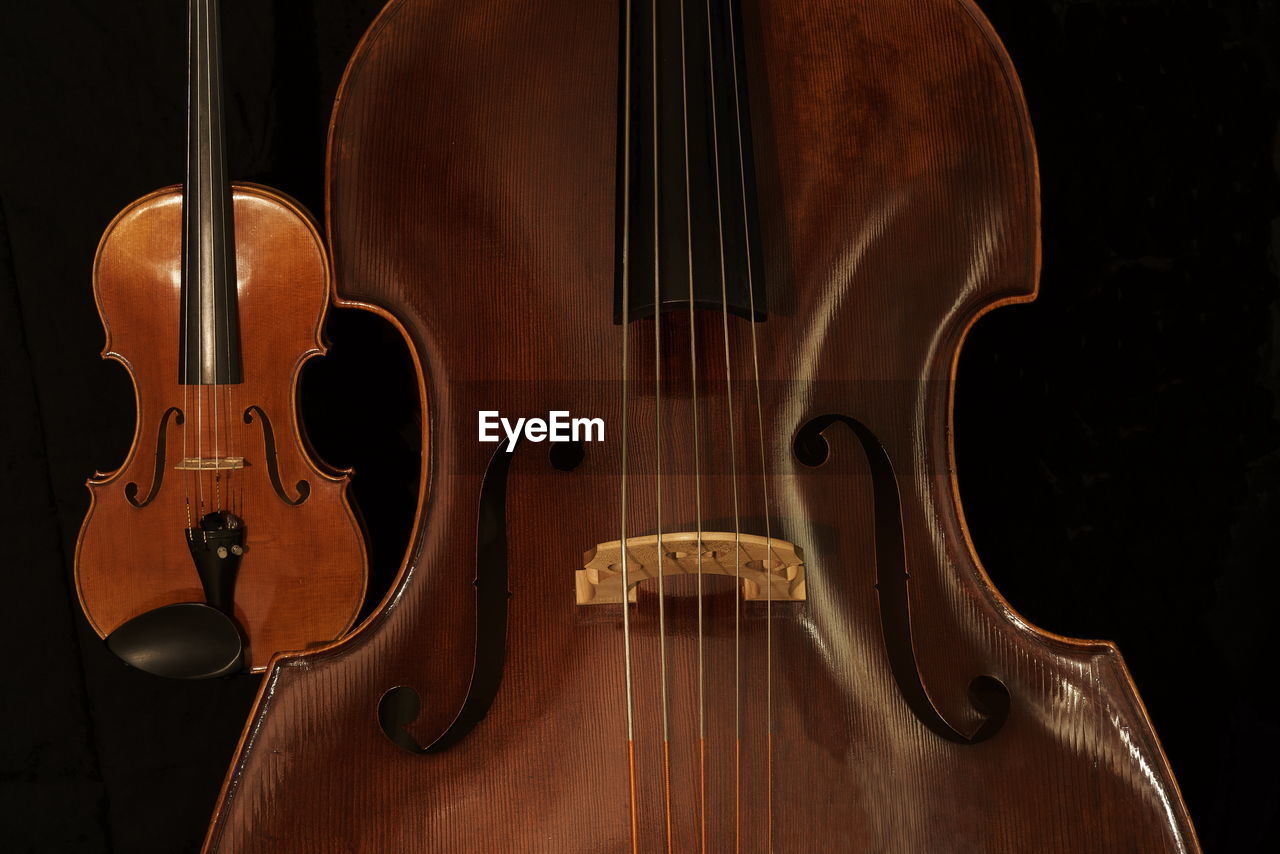 Close-up of violin against black background