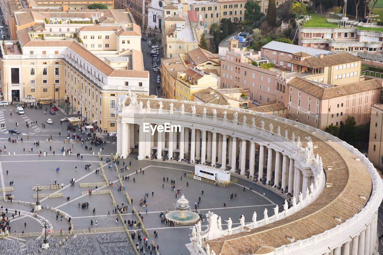 High angle view of people at historic st peter square from basilica