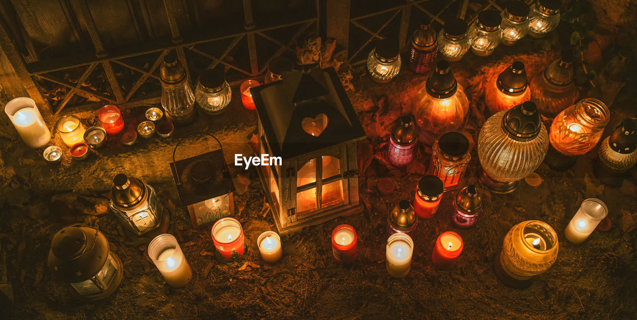 Group of candles in cemeteryduring all souls' day