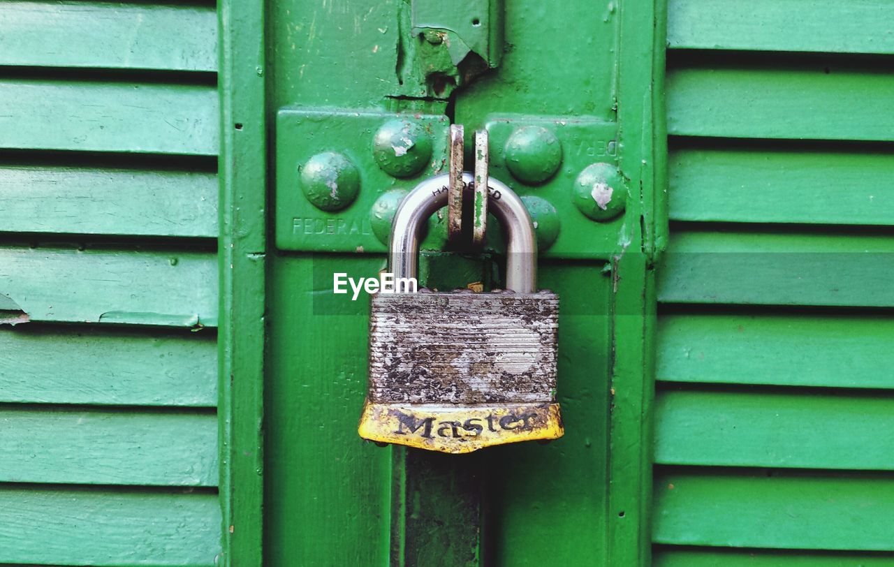 Close-up of rusty metal door and lock