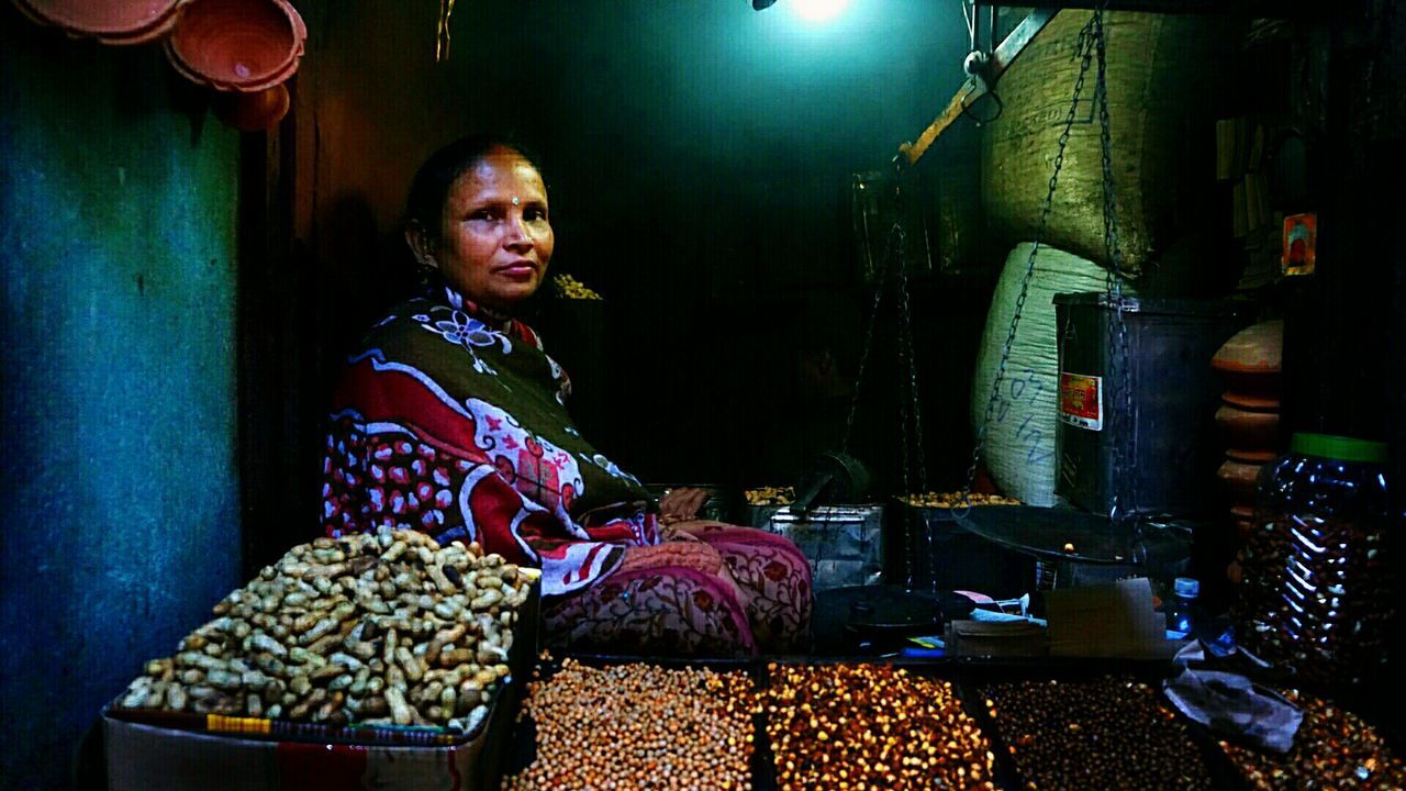 THOUGHTFUL LOOKING AT ILLUMINATED SHOP