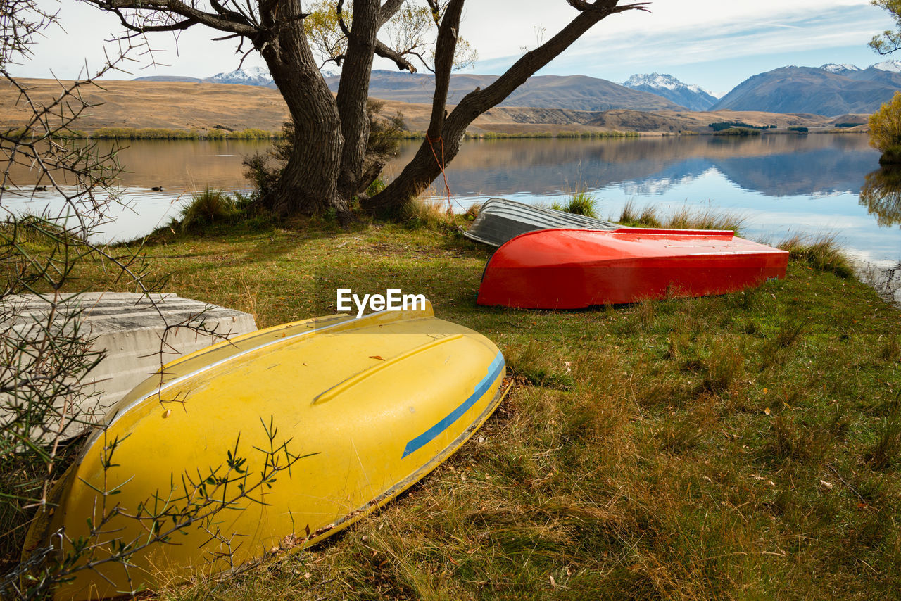 BOATS MOORED AT LAKESHORE