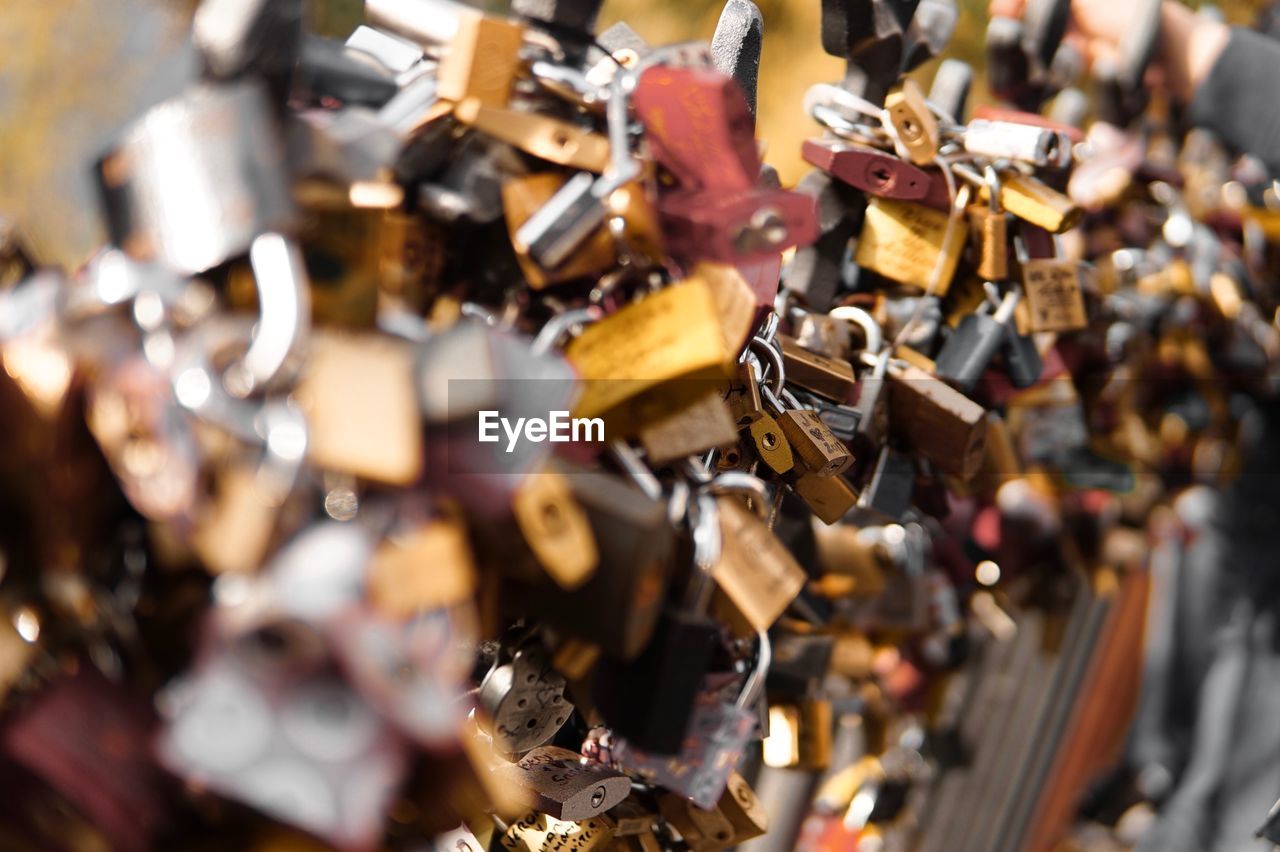 Close-up of love locks on railing