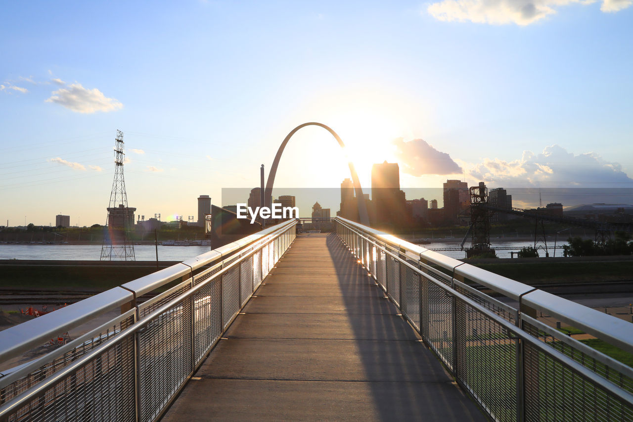 View of bridge over river at sunset