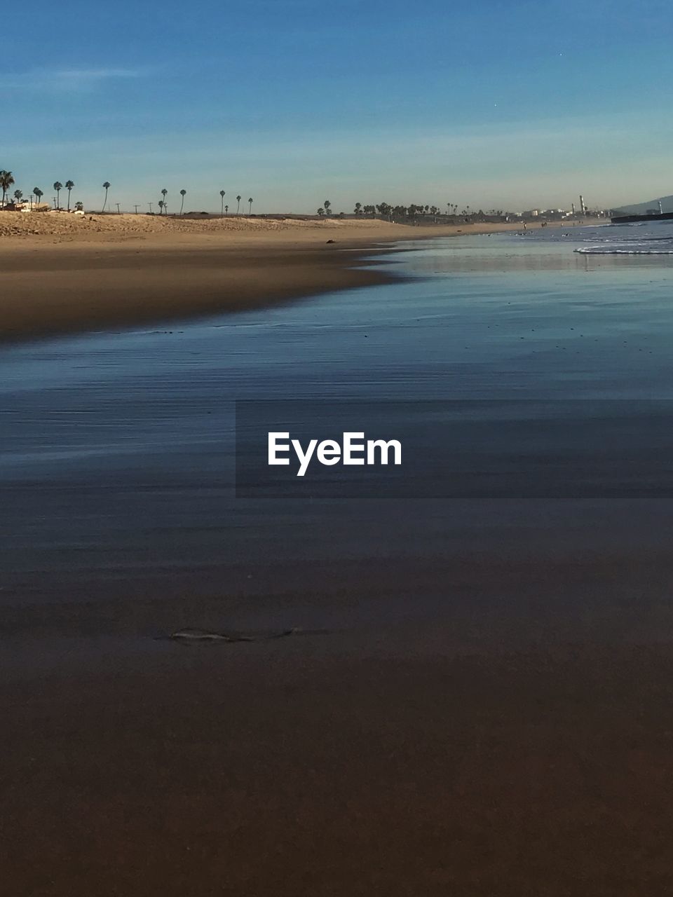 BEACH AGAINST SKY