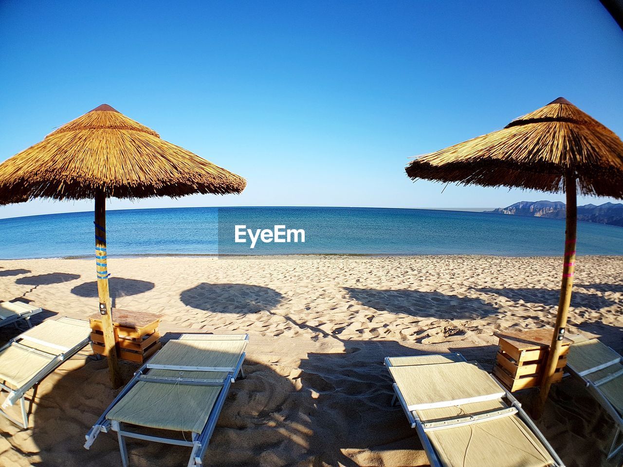 GAZEBO ON BEACH AGAINST CLEAR SKY