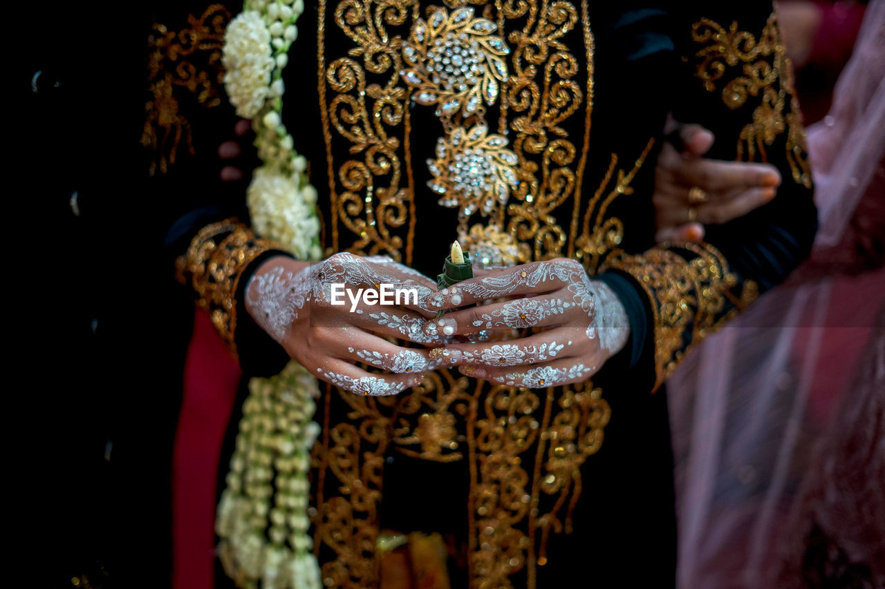 Close-up of bride in wedding dress 