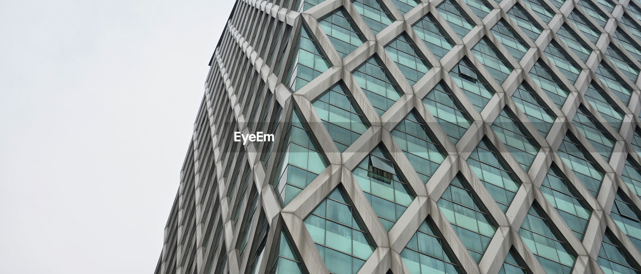 Low angle view of modern building against sky