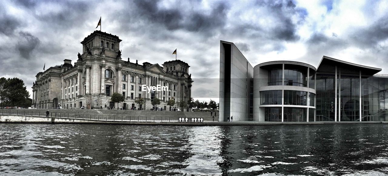 VIEW OF BUILDINGS AGAINST CLOUDY SKY