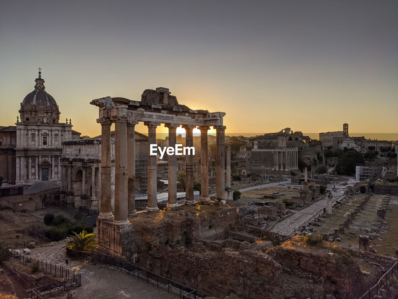 HISTORIC TEMPLE AGAINST SKY AT SUNSET