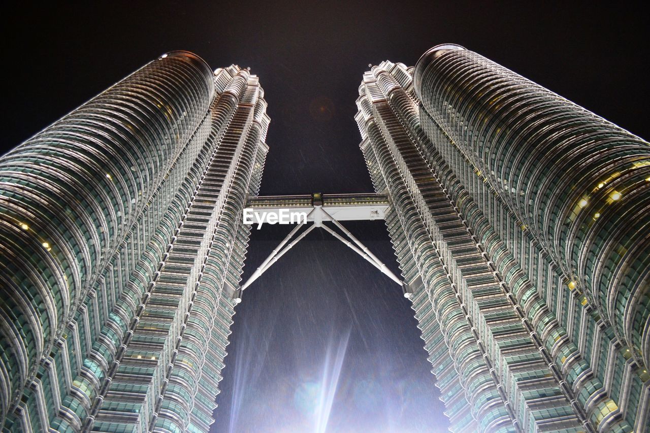 Low angle view of modern buildings at night