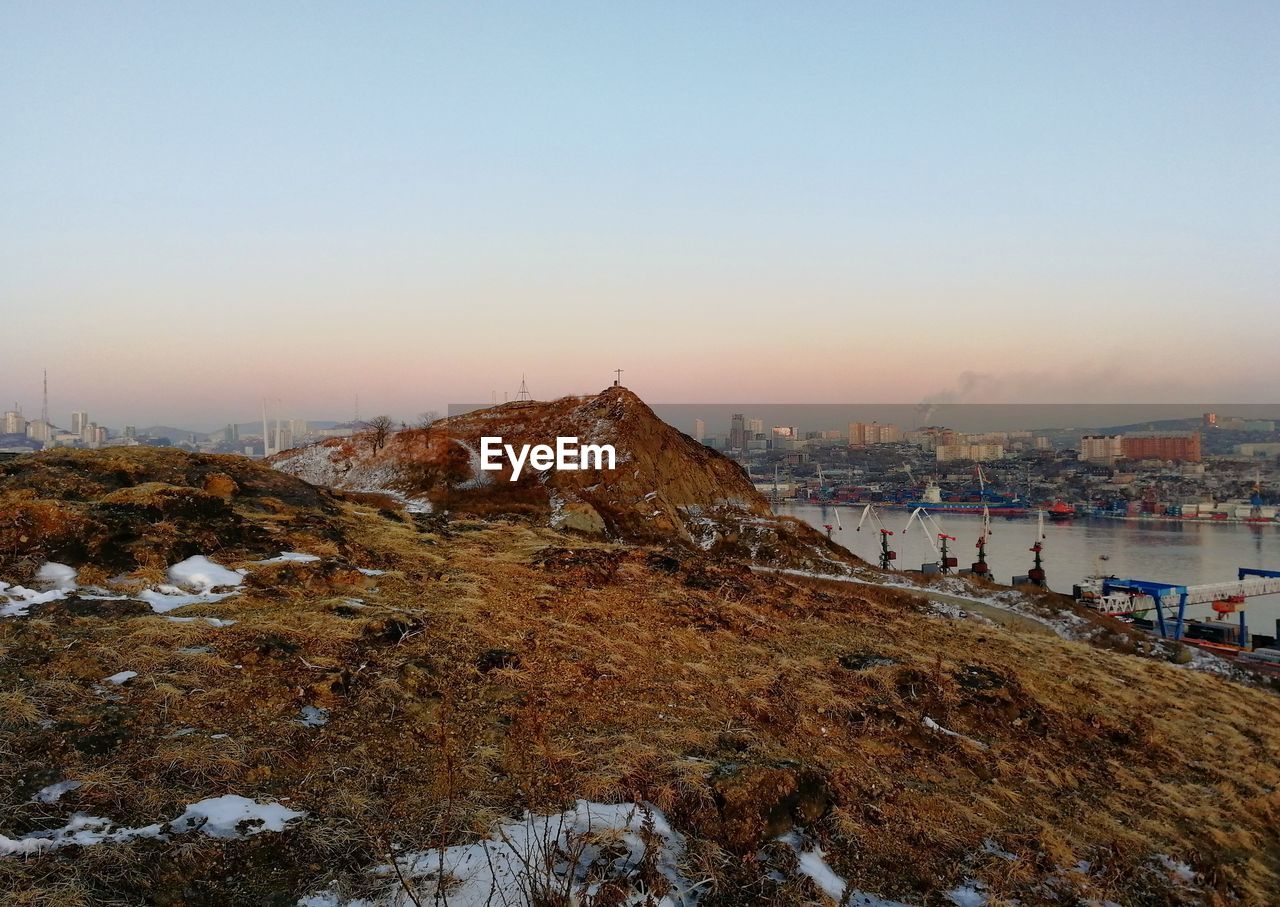 Panoramic view of cityscape against clear sky during sunset