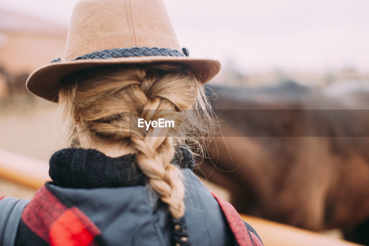 Rear view of cowgirl