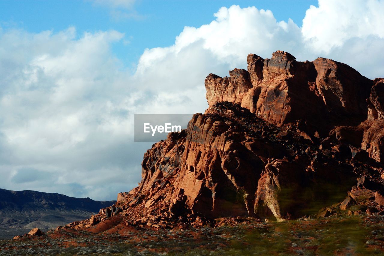 Rock formations on landscape against sky