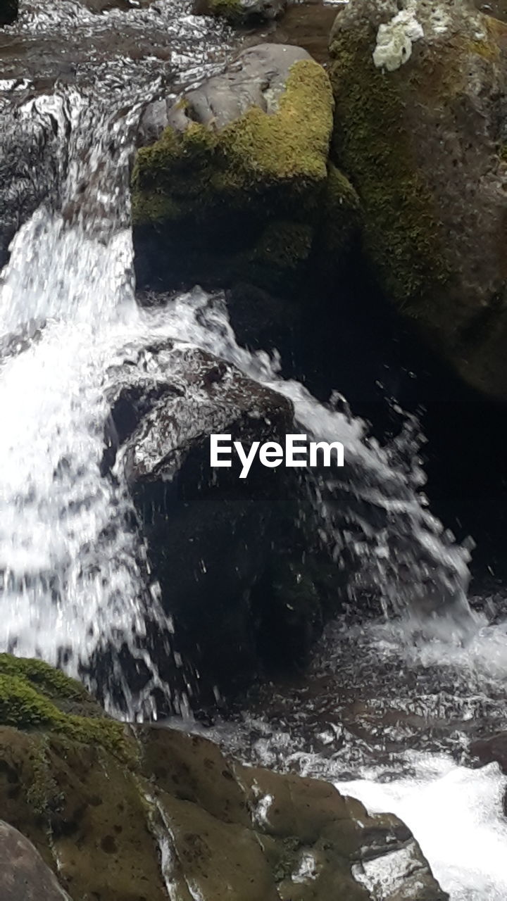 WATER SPLASHING ON ROCK