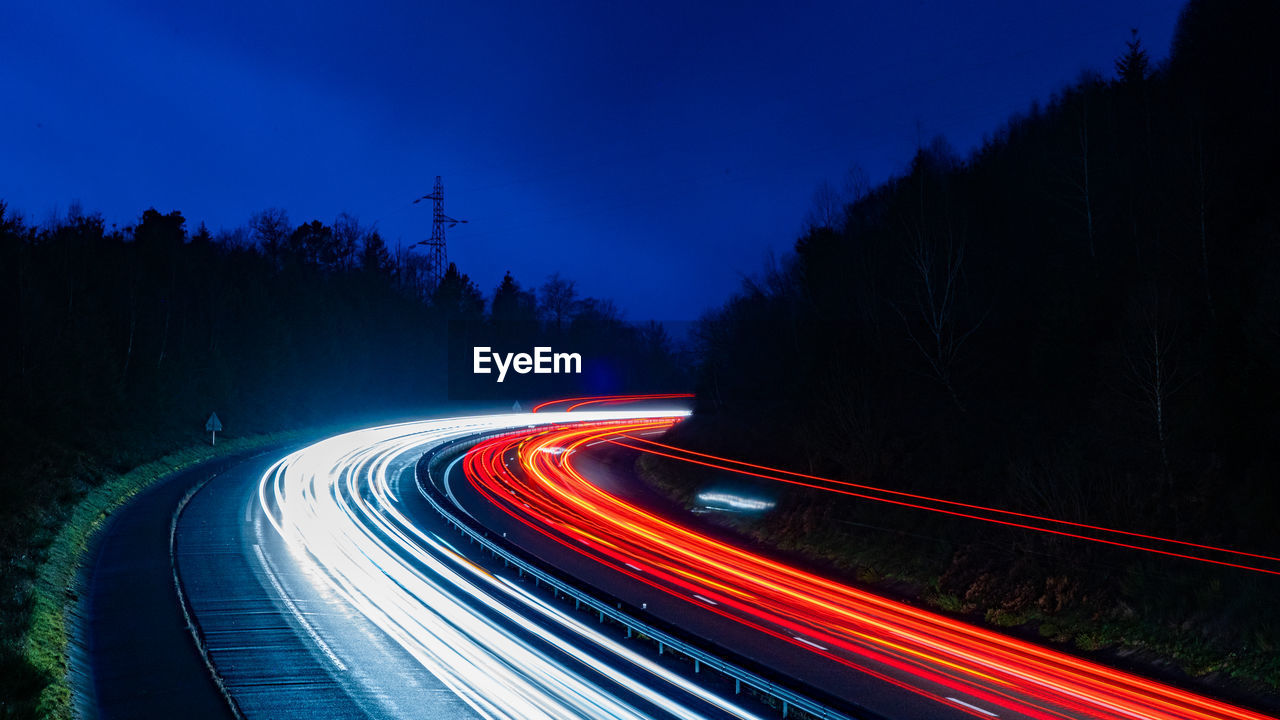 Light trails on road at night