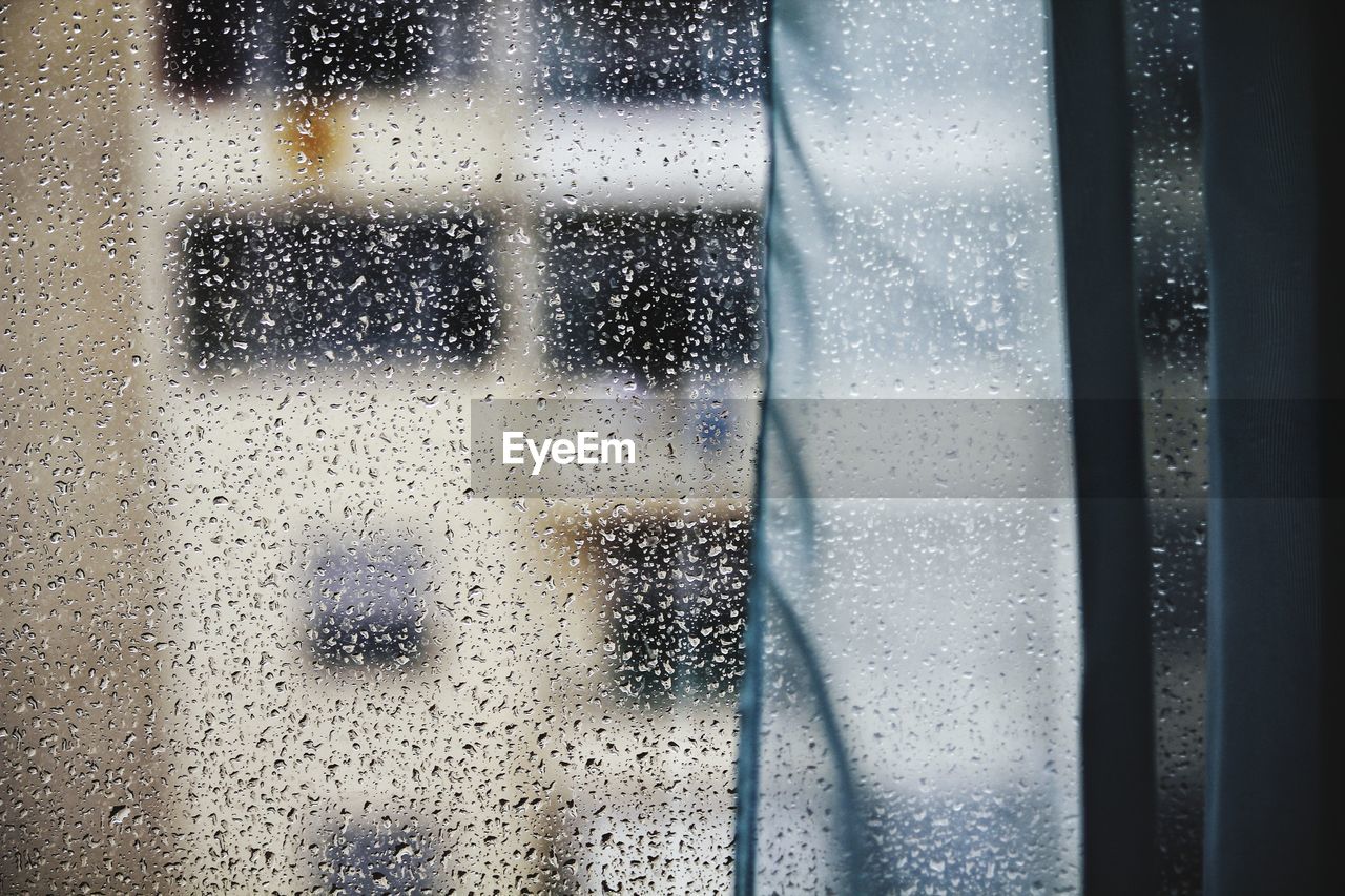 FULL FRAME SHOT OF WET GLASS WINDOW