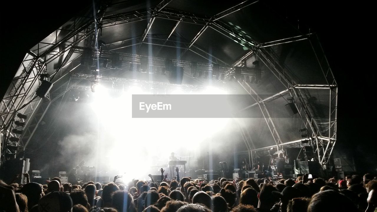 Rear view of people enjoying music in concert