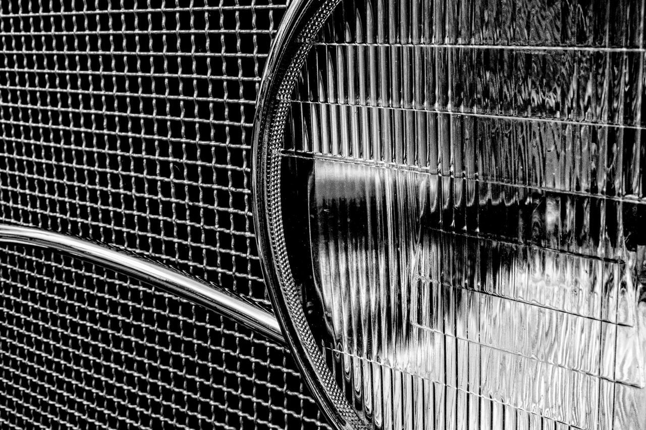 Close-up of vintage car headlight