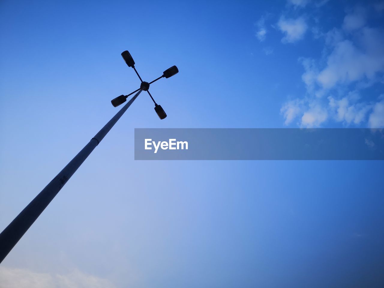 sky, blue, wind, low angle view, cloud, nature, street light, no people, wind turbine, line, machine, day, outdoors, copy space, technology