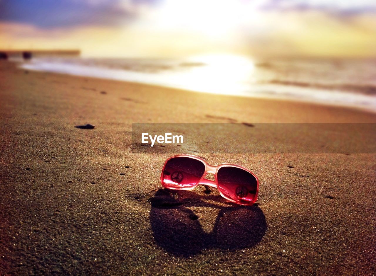 Sunglasses on sand