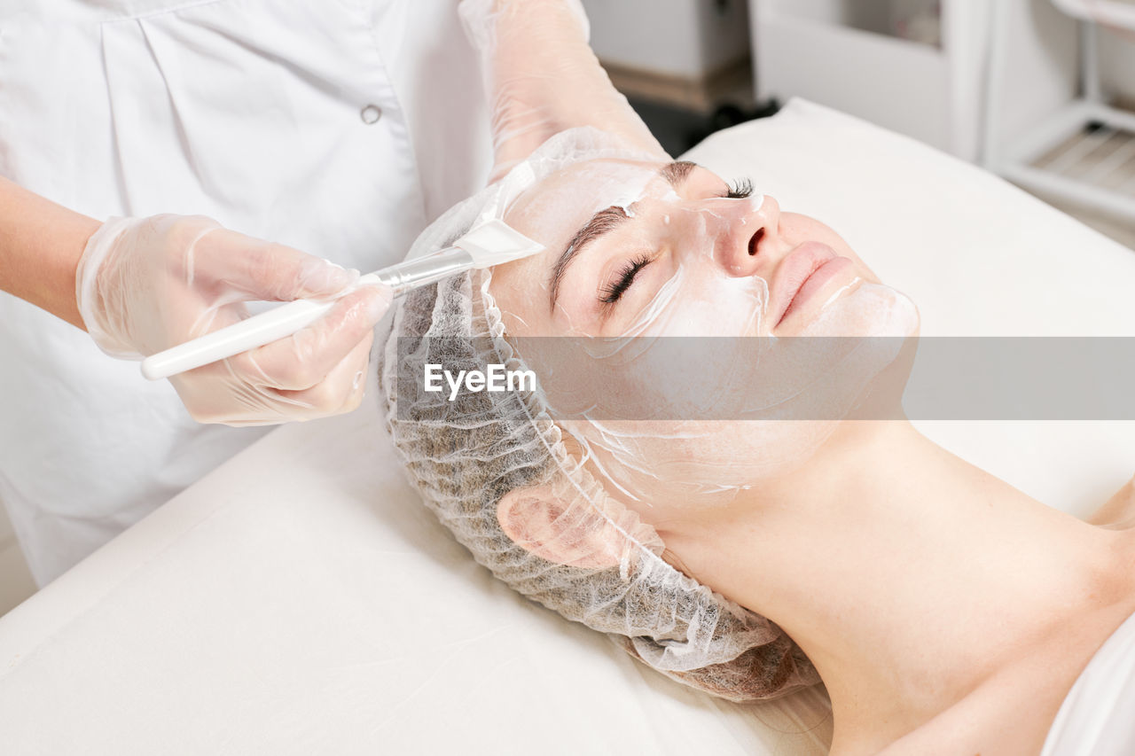 beauty spa, body care, adult, spa treatment, beauty treatment, women, human face, wellbeing, relaxation, healthcare and medicine, health spa, lying down, skin, skin care, two people, facial mask - beauty product, indoors, human skin, female, young adult, hand, patient, occupation, exfoliation, eyes closed, massaging, hygiene, applying, person, lifestyles, professional occupation, doctor, medicine, care, body care and beauty, beauty product, alternative therapy, white, spa, therapy, towel, surgery, human head, lying on back