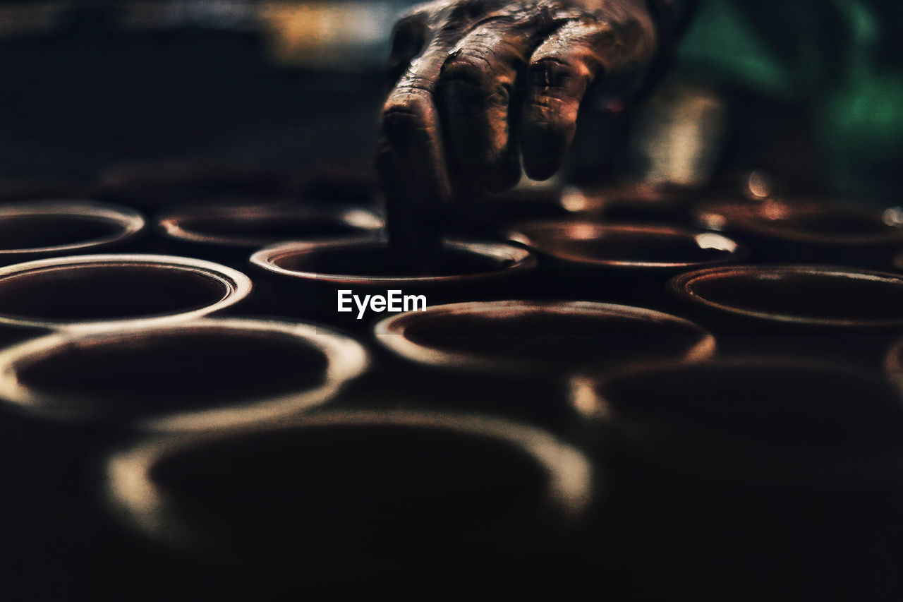 Close-up of human hand making pots